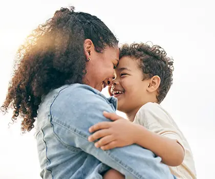 Woman holding young boy